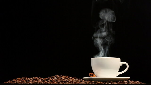 Cup of coffee on black background