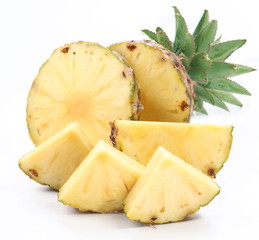 Cut ripe pineapple with rich green rosette.