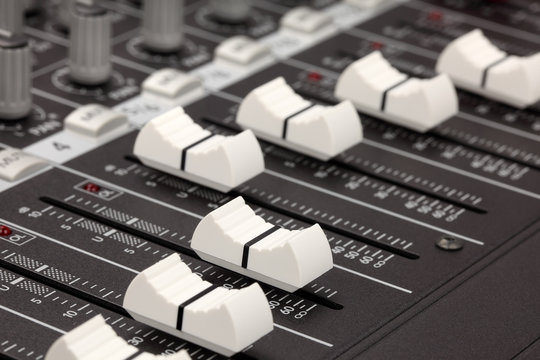 closeup of audio mixing console