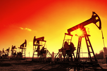working oil pumps silhouette in row