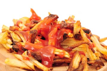 French fries drizzled with ketchup