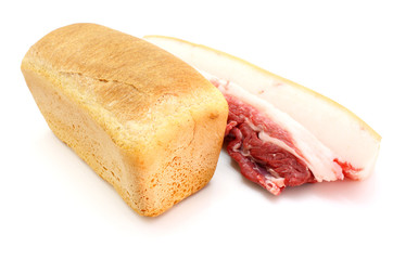 Roll of fresh bread and the big piece of fat with meat