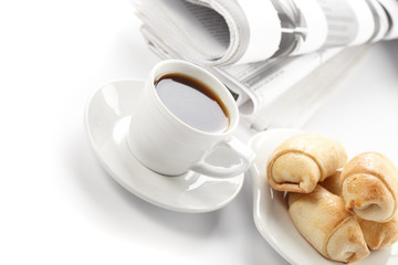 Cup of fragrant coffee on a morning paper business news