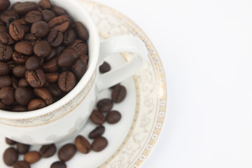Coffee beans in cup