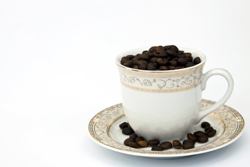 Coffee beans in cup