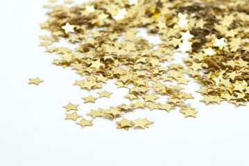 close up of confetti on white background