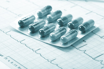 pills on the cardiogram
