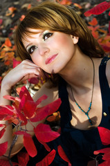 Naklejka premium The girl in autumn wood