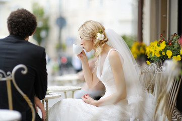 Bride and groom at outdoor cafe