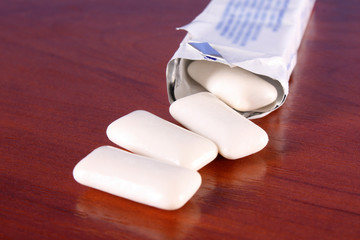 Chewing gums on brown