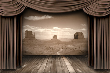 Hanging stage theater curtains with a desert  background