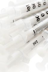 Insulinic syringes on a white background