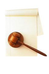 blank legal pad and law gavel, on white