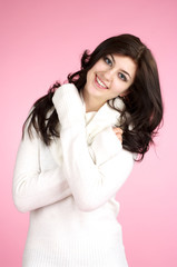 Young cheerful woman with white sweater