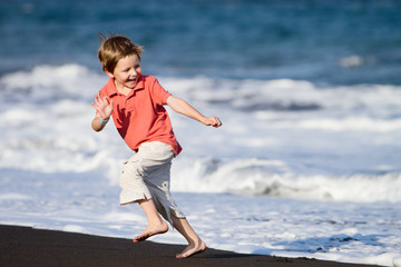 Kid Runs On The Beach