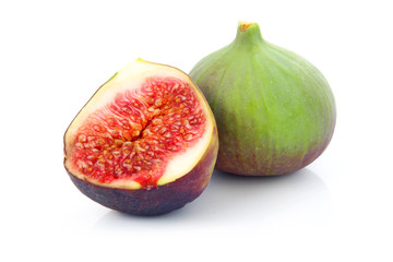 Ripe sliced purple and green fig fruit isolated