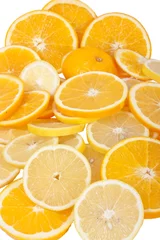 Foto op Canvas Sinaasappel- en citroenschijfjes geïsoleerd op een witte achtergrond © Sebastian Studio