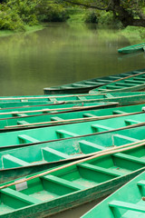 Fototapeta na wymiar Wooden boats anchored on river (1)
