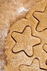 gingerbread  star cookie cuts dough, background