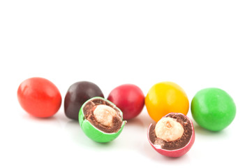 Pills with peanuts covered with multicolored glaze