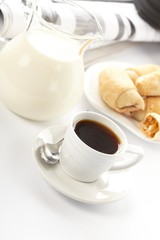 Cup of fragrant coffee on a morning paper business news