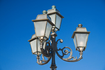 Fototapeta na wymiar Street-lamp on blue sky.
