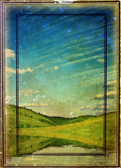 grunge photo of green field and blue sky
