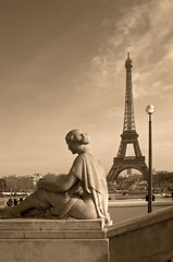 Eiffel tower with a woman's sculpture (Paris, France)