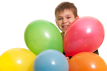 Smiling boy in the multicolored balloons