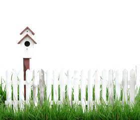 birdhouse white fence and green grass
