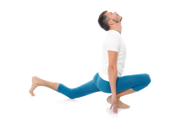 young man practising yoga postures combination suri namaskar. is