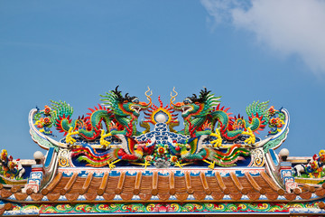 Chinese style twin dragon sculpture in the roof top