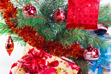 New Year's still-life- fur-tree branches,a tinsel and a gift box