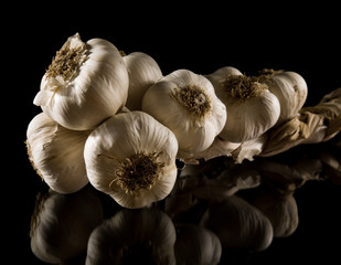 plait of garlic bulbs close-up isolated