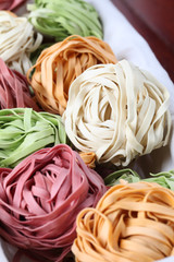 Tagliatelle pasta dyed with vegetables