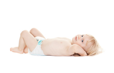 cute baby lies hands behind his head isolated on white