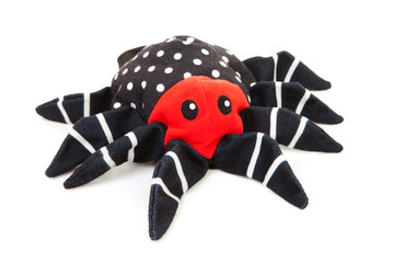 fabric spider toy over white background