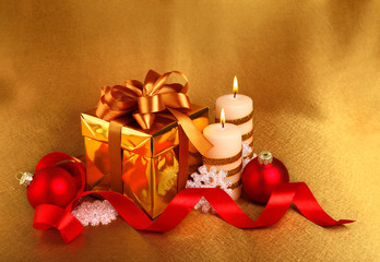 christmas gift in gold box with bow