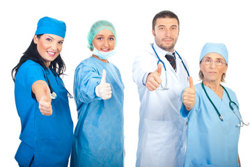 Team of doctors giving thumbs
