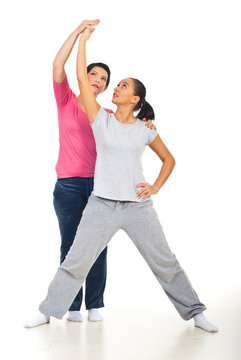 Young woman with personal trainer