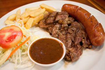 Beef steak and sausage