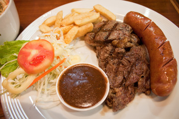 Beef steak and sausage