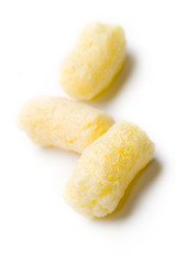 Crunchy corn snacks on white background