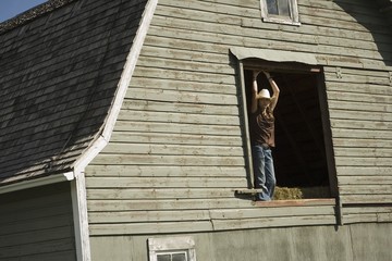 Young Woman In Barn Loft