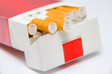 cigarettes in box marked with skull and bones sign