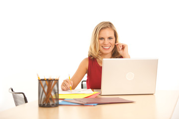 Businesswoman at desk with laptop