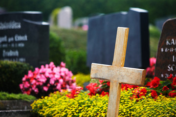 wooden cross on a cemetery