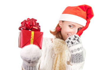 Happy smiling woman in christmas hat with gifts