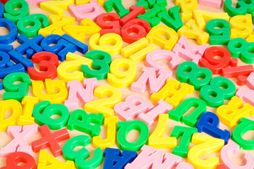 Children letters and digits on the table