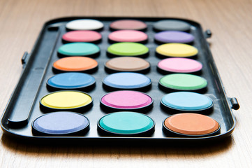 Art concept with painters palette and paint brush